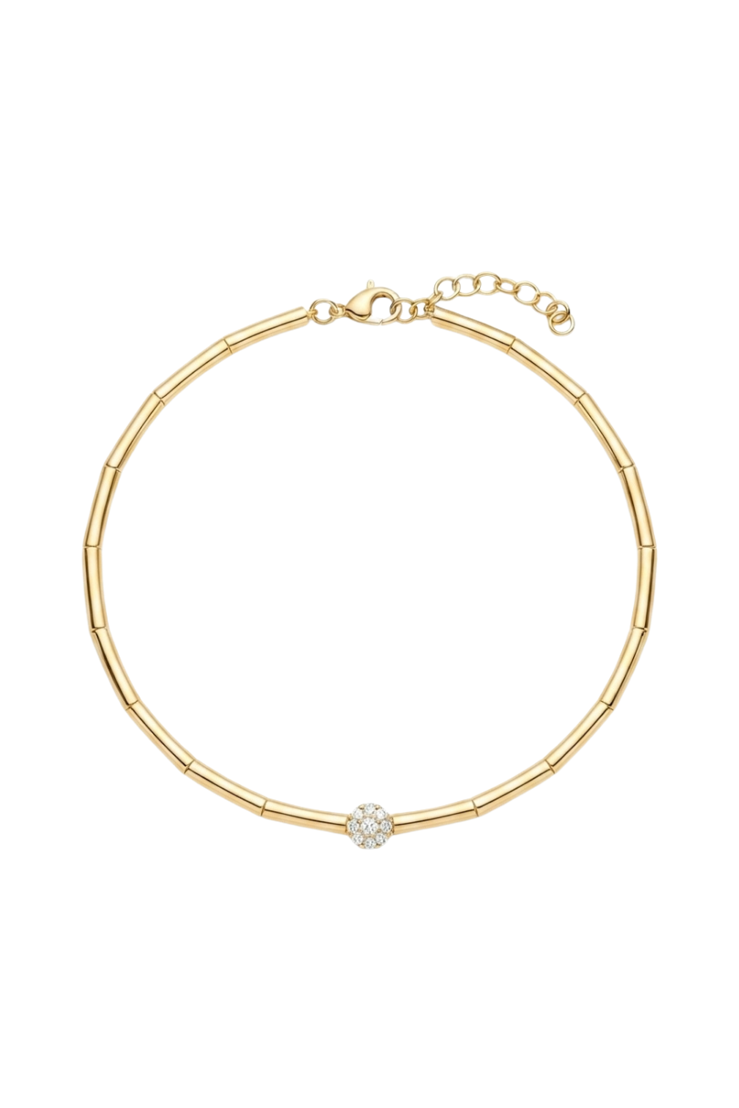 a gold bracelet with a diamond