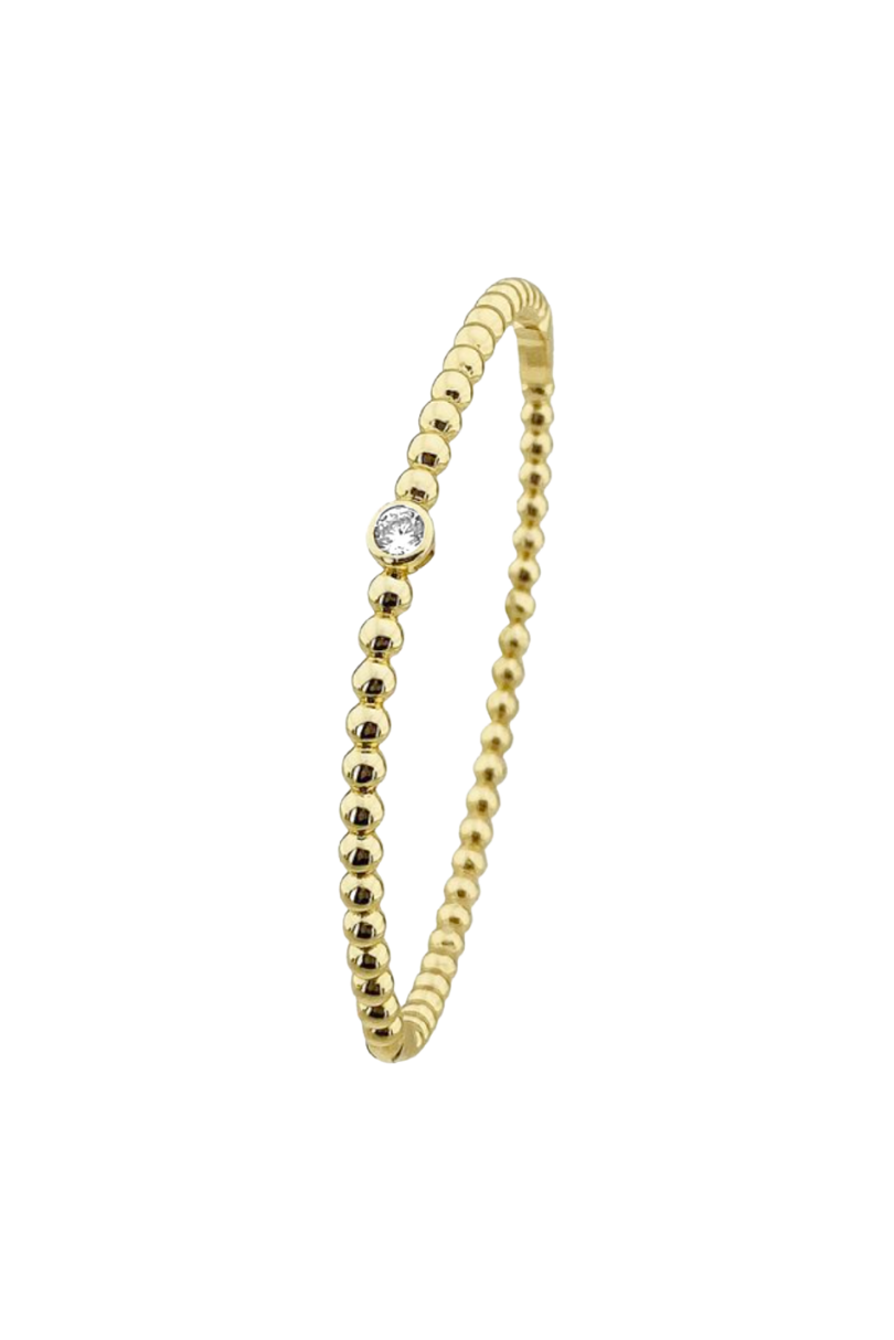 a gold bracelet with a diamond