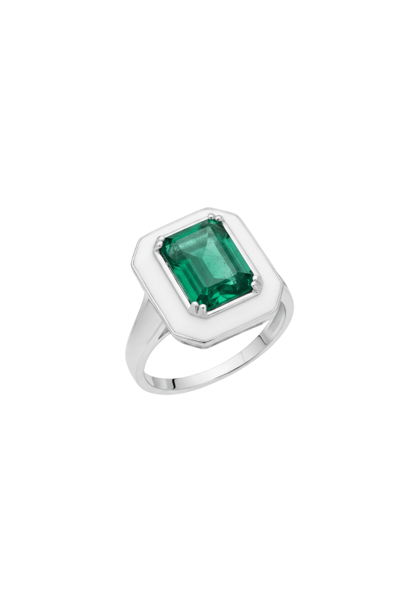 Silver ring with a green gemstone on a white background