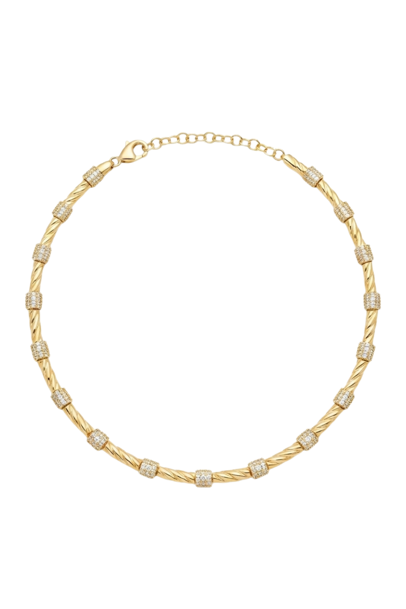 a gold necklace with diamonds
