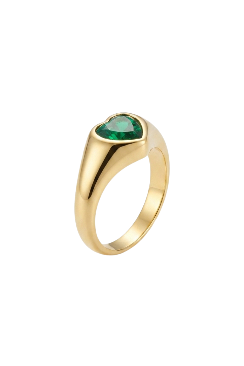 a gold ring with a green stone in the middle