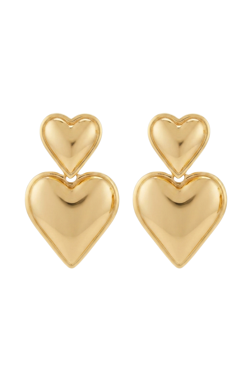 a pair of gold heart shaped earrings