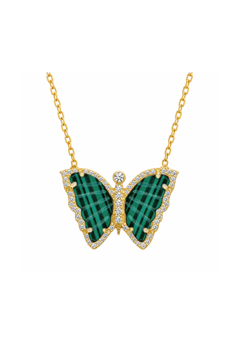 a gold chain with a green and white butterfly pendant