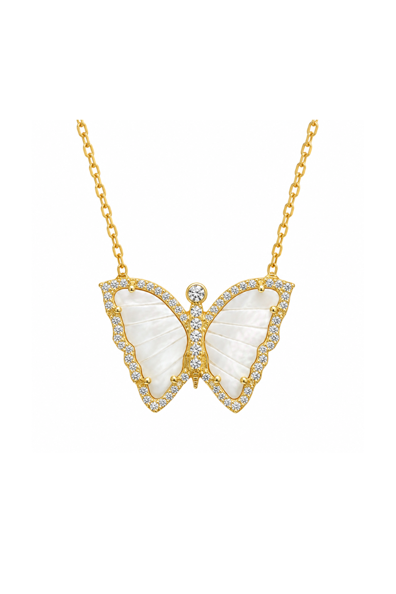 A gold butterfly pendant necklace featuring mother-of-pearl wings and pavé-set clear stones, suspended from a delicate gold chain against a solid white background.