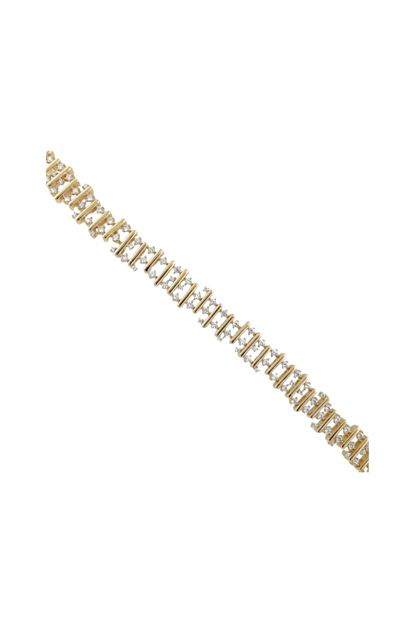 a gold and silver bracelet with diamonds