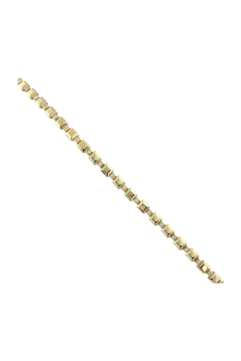 a gold bracelet with diamonds