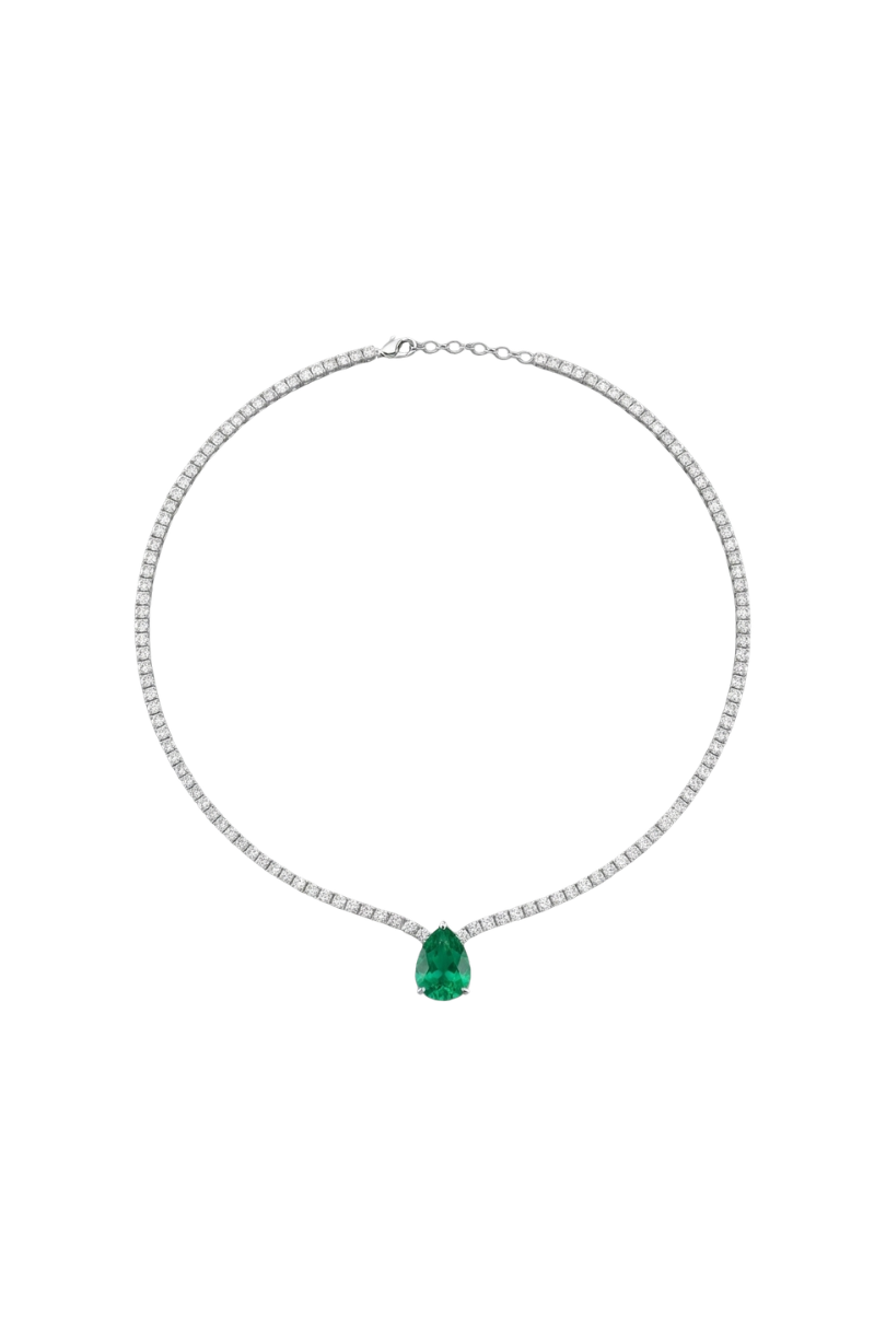 a necklace with a green gem