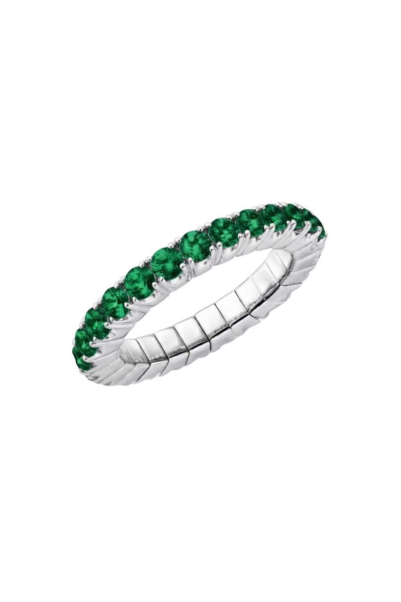 a ring with green gemstones