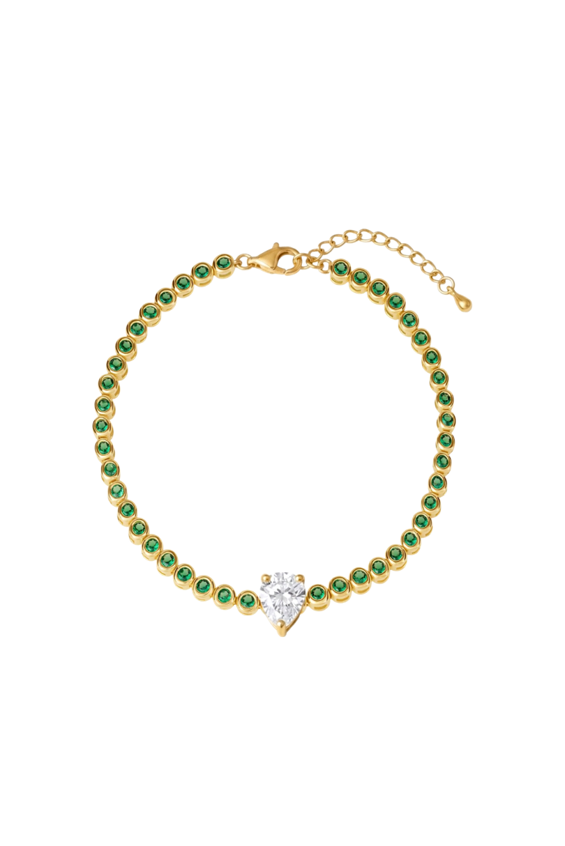 a gold bracelet with green stones and a diamond